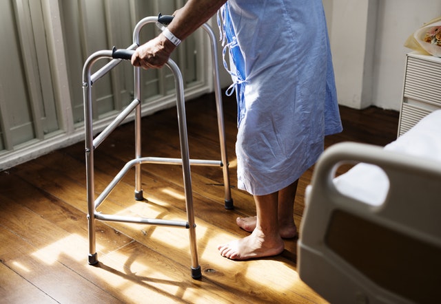 https://www.pexels.com/photo/person-in-hospital-gown-using-walking-frame-beside-hospital-bed-748780/